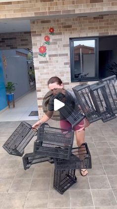 a woman is holding two empty shopping carts