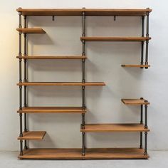 the shelves are made out of wood and metal