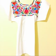 Mexican Embroidered Blouse Hand Embroidered In Colorful Fiesta, Dress It Up Or Tuck In Bell Bottoms Jeans And Vintage Platforms! Aida Coronado Collection Hippie Boho Chic Folk Indigenous Top Ethnic Embroidery Fiesta Festival Vintage Style Nwt High Quality Handcrafted Clothing Fine Details Blouse Top Mexican Vintage Traditional Handmade Ooak Unique Art Folk From Mexico With Love 100% Cotton Medium Weight Colorful Embroidery Party Birthday Mexican Fiesta Blouses White Folk Dress With Resham Embroidery, Festive Short Sleeve Top With Embroidered Neckline, White Geometric Embroidered Short Sleeve Dress, White Floral Embroidered Top For Festivals, White Embroidered Top With Embroidered Hem For Festival, White Short Sleeve Embroidered Dress With Geometric Pattern, White Short Sleeve Dress With Geometric Embroidery, White Crew Neck Blouse With Floral Embroidery, White Embroidered Top With Hem Detail For Festivals