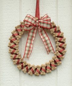 a christmas wreath hanging on the side of a door