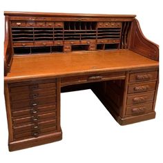 an old wooden desk with many drawers