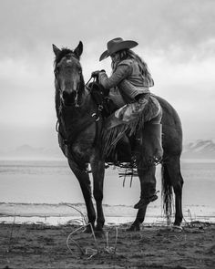 black and white photograph of a man on a horse