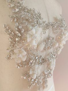 Gorgeous wedding / bridal applique with high quality, genuine crystal rhinestones, crystals, beads, rhinestones and beads are all hand sewn . Delicate bridal applique , dotted with silver rhinestone ,beads , pearls and crystals. with large beads in the center , perfect for bridal sash, belts, wedding accessories, bridal head piece etc size: Price is for one piece. more in stock ~ Please this is only applique, which supposed to be made into belts or sashes after your DIY Check more amazing laces Fitted Rhinestone Bridal Accessories For Party, Fitted Bridal Accessories With Rhinestones For Party, Party Crystal Embellished Bridal Accessories, Embellished Lace Bridal Belt, Embellished Lace Bridal Belt For Wedding, Embellished Crystal Bridal Belt, Fitted Crystal Bridal Belt Embellished, Fitted Crystal Embellished Bridal Belt, Fitted Embellished Bridal Accessories For Party