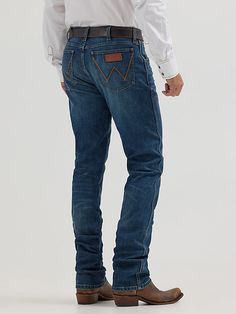 OUR WESTERN ROOTS MADE MODERN Wrangler® Retro® slim fit jeans nod to our history while introducing fits and washes suited for the modern cowboy. Designed with a closer fit and leg opening that still falls comfortably over boots, our men's Wrangler® straight leg slim fit jeans add extra style to the classic look you love. These jeans sit low on the waist and make it easy to show off your favorite belt buckle. That design detail is our Western heritage showing through, something that happens often Cowboy Pants, Modern Cowboy, Straight Leg Jeans Men, Mens Cowboy, Cowboy Style, Wrangler Jeans, Slim Straight Jeans, Country Style, Belt Buckle