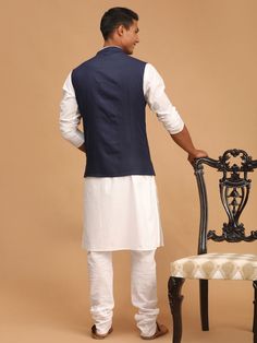 VASTRAMAY Men's Navy Blue Solid Cotton Nehru Jacket With White Kurta And Pyjama Set A stylish ensemble for any occasion, this set combines a navy blue solid cotton Nehru jacket with a crisp white kurta and matching pyjamas. Key Features: Navy blue solid cotton Nehru jacket White kurta Matching pyjamas Specifications: Color: Navy blue and white Material: Cotton Size Options: S, M, L, XL, XXL Material & Care: 100% Cotton. Machine wash cold with like colors. Tumble dry low. Warm iron if needed. Top Blue Nehru Jacket For Festive Workwear, Festive Blue Nehru Jacket For Workwear, Festive Blue Nehru Jacket For Work, Blue Nehru Jacket For Diwali Semi-formal, Blue Nehru Jacket For Semi-formal Diwali Occasion, Mens Cotton Kurta, Kurta Pajama With Nehru Jacket, Matching Pyjamas, White Kurta