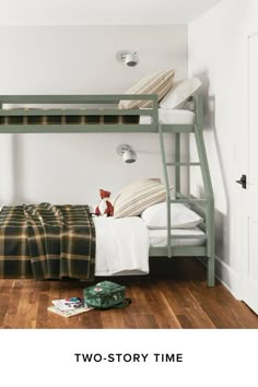 there is a bunk bed in the room with two pillows and a teddy bear on the floor