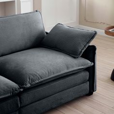 a couch with two pillows sitting on top of it