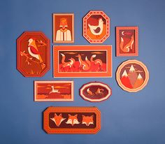 several different types of decorative items on a blue surface with red and orange designs in the middle