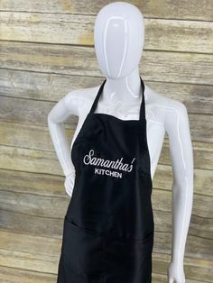 a mannequin wearing an apron with the words savannah's kitchen on it