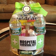 a hospital survival kit sitting on top of a glass table in front of a couch