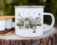 a white coffee mug sitting on top of a wooden table next to a piece of bread