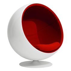 a white and red ball chair sitting on top of a table