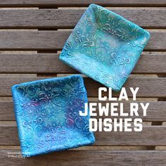 two square glass dishes sitting on top of a wooden table with the words clay jewelry dishes