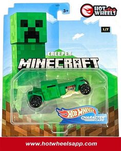 a green toy car in the packaging