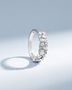 Embrace timeless romance and modern artistry with the La Fantaisie Half Band. This exquisite piece is a symphony of light, featuring an array of baguette and princess-cut white diamonds, each chosen for their radiance and clarity. Details 18k yellow gold, rose gold or white gold 0.97 carats of baguette, princess and round white diamonds 5.5mm width Ref: BAR1054D Luxury White Baguette Cut Diamond Ring, Luxury White Diamond Ring With Baguette Diamonds, Luxury Emerald Cut Diamond Ring With Baguette Diamonds, Luxury Diamond Ring With Single Cut Baguette Diamonds, Luxury White Baguette Diamond Ring, Luxury Baguette Cut Diamond Ring With Accents, Luxury Baguette Cut Ring With Single Cut Diamonds, Timeless Everyday Luxury Diamond Ring, Elegant Cubic Zirconia Cluster Ring