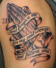 a tattoo on the back of a woman's arm with words and ribbons around it