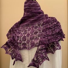 Hand knit crescent shawl/shawlette in variegated purple merino wool yarn. It can be used as a winter accessory to keep neck/shoulder warm, and light weight with a lace border makes this shawl a great accessory for warm spring/summer weather.    Size: Width 62" Height 18"  Material: 75% Superwash Merino wool, 25% Nylon  Care: Machine wash gentle, lay flat to dry   It will be shipped by priority mail with a tracking number. Crescent Shawl, Hand Knit Shawl, Merino Wool Yarn, Warm Spring, Lace Border, Knitted Shawls, Winter Accessories, Wool Yarn, Shawls And Wraps