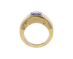 Striking in its intense color and modern design, this Retrouvai ring has a breathtaking presence. The rectangular blue-lavender tanzanite is set vertically and bezel set within the tiered 14K yellow gold polished band. Wear it as a statement making alternative to the traditional cocktail ring. It is a modern classic. tanzanite : 7.5mm x 7mm : 2.41ct14K yellow gold band width : 5mm to 9mmsize available : 6.5please contact us for sizing options Modern Yellow Gold Sapphire Ring For Formal Events, Modern Yellow Gold Sapphire Ring For Formal Occasions, Modern Emerald Cut Amethyst Ring, Modern Sapphire Ring With Bezel Setting For Formal Events, Modern Tanzanite Gemstone Ring, Formal Rectangular Sapphire Ring Fine Jewelry, Modern Tanzanite Rings, Formal Rectangular Sapphire Ring, Modern Sapphire Baguette Cut Ring For Formal Occasions