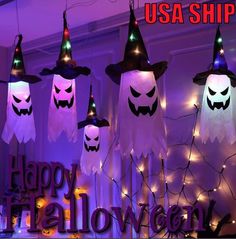 lighted halloween decorations hanging from the ceiling with words usa shipping happy halloween written on them