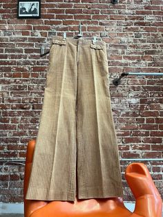 Mens 70s Tan Wide Wale Corduroy Wide Leg Pants Lush men's seventies tan wide wale corduroy wide leg pants. Talon zipper fly with a hook and bar closure at the waist. Front and back pockets and two faux small front pocket flaps a button each as a beautiful design element. Small belt loops. In fantastic vintage condition.  By John Carl for Charsel Note: Wide Leg means the leg is wide, it does not mean a flare  Measurements:  35" waist  44" hip-hip measurement is key when buying seventies pants. If they do not go over your hips they will not fit.  34" inseam  12" rise  22" hem circumference  21.25" knee circumference  27.5" thigh circumference  45.5" length No returns or exchanges  Feel free to message us with any questions. We are happy to help and quick to respond. 🌻 Stay in touch @look.vi Corduroy Wide Leg Pants With Belt Loops, Retro Corduroy Pants With Pockets, Vintage Corduroy Pants With Pockets, Mens Wide Wale Corduroy Pants, Corduroy Wide Leg Pants, Corduroy Flare Pants, Men’s Courdoroy Pants, Wide Wale Corduroy, Small Belt