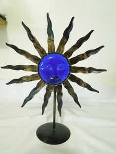 Add a touch of celestial charm to your home decor with this Sun / Moon Face Candle Holder. The cobalt blue glass and metallic finish give it an abstract and stylish look that is perfect for any room. It comes with a new candle and let the warm glow fill the room. This Candle Holder is perfect for collectors and enthusiasts of all things decorative. The Moon subject, Stars pattern, and Blue color make it a unique addition to your collection. Get this exquisite piece today and elevate the ambiance Vintage Celestial Decor, Moon Candle Holder, Moon Candle, Jewelry Box Diy, Cottage Vintage, Stars Pattern, Moon Face, Celestial Art, Thrift Inspo