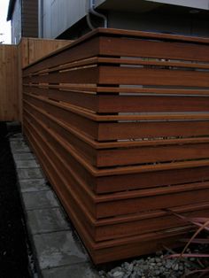 a wooden fence in front of a house