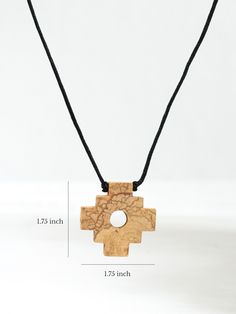 Distinct fragrance of wood sustainably harvested from the Palo Santo tree. Solid wood chakana cross dangles from a round black cord adjustable with sliding knots for the length you want. Measures 1.75" x 1.75" Black 24" adjustable cord Adjustable Artisan Natural Wood Necklace, Adjustable Cross Pendant Jewelry, Adjustable Wooden Beads Cross Jewelry, Adjustable Cross Jewelry With Wooden Beads, Adjustable Cross Necklace With Wooden Beads, Adjustable Natural Wood Spiritual Jewelry, Adjustable Natural Wood Traditional Jewelry, Adjustable Traditional Natural Wood Jewelry, Adjustable Cross Necklace With Cord