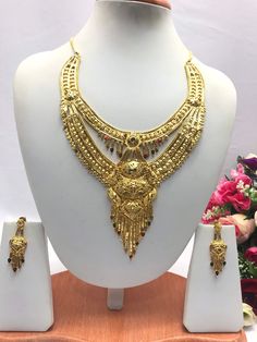 "Handmade Indian Bridal Wedding Jewelry 22ct Heavy Gold Plated Necklace Set with Earrings Indian Jewelry Indian Bollywood Jewelry , its Artificial Jewelry  Type :22ct Gold Plated Necklace Set Earrings Length: 2.5\"inches Approx Shape - As Shown in Picture It is a perfect match with formal attire on special occasions or with casual wearing The item will come with the clear plastic box or plastic bag and packaging Traditional Indian Wedding Jewellery Slight Colour variations possible due to differ 22k Gold Dual-tone Jewelry For Wedding, Dual-tone 22k Gold Wedding Jewelry, Traditional Dual-tone Gold Jewelry Sets, Traditional Gold Dual-tone Bridal Necklace, Traditional Gold Bridal Necklace With Dual-tone, Traditional Dual-tone Gold Bridal Necklace, Dual-tone Yellow Gold Wedding Jewelry, Bollywood Style Dual-tone Gold Jewelry Sets, Gold Dual-tone Jewelry For Wedding