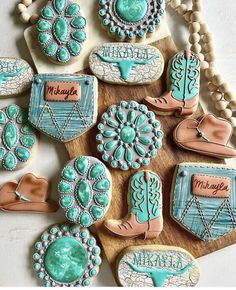 decorated cookies are arranged on a board with beaded trimmings and beads around them