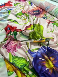 an image of colorful flowers on a bed sheet