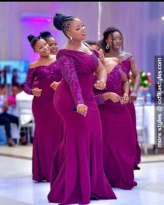 three women in purple dresses standing on a dance floor with one woman wearing an off the shoulder dress