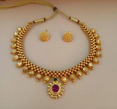 Material:- Brass, Gold Platted Pack- Necklace Set With Earrings These Beautiful Gold Platted Necklace Best for gifting and personal use, You can gift your Girlfriend, Mother, Sister , Relatives , Neighbours etc. Combine it with Matching Dress and be the Limelight of every Occasion ( Diwali, Birthday, Anniversary, Christmas, Any Ritual Festival). Suitable for all Occasions. a)These are very skin Friendly. b)The plating is Non- Allergic and safe for all Environment. Gift for Her, Best Friend Gift, Navratri Gift Bridal Necklace With Latkans, Temple Jewelry Sets With Round Beads For Festivals, Round Temple Necklace For Navratri Gift, Navratri Bridal Necklace With Latkans As Gift, Kundan Necklace Gift For Navratri, Festive Kundan Necklace With Latkans As Gift, Bridal Necklace With Gold Beads For Festivals, Handmade Round Bridal Necklace For Festivals, Round Temple Necklace With Latkans For Festivals