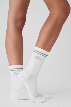 Step into your new favorite socks—they’re stretchy and sweat-wicking (for performance) and finished with a reflective Alo logo (for subtle flash in low light). Don’t miss the functional details, like ribbing at the ankles, ribbing at the midfoot and slight padding at the heels and toes for a comfortable fit. Alo Socks, Tank Top Bras, Womens Capris, Tank Top Long Sleeve, Womens Wellness, Low Light, Physical Fitness, Bra Women, Hat Hairstyles