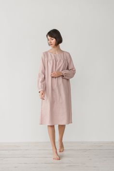 "MONA gather dress made from soft linen in dusty pink. - length is ± 107 cm (42\") (depends on size) - gathered front, back and sleeves - loose fit - without pockets DETAILS: - 100 % European, pre-washed medium weight linen (205 g/m²) - the model is 176 cm (5′9″) high, wearing size S. - model measurements: bust 83 cm (33\") / waist 61 cm (24\") / hips 90 cm (36\") - color in the picture - dusty pink (you can choose other color on the right) MADE TO ORDER: All pieces are made to order, it will ta Pink Long Sleeve Nightgown For Nighttime, Pink Long Sleeve Nightgown, Feminine Long Sleeve Dress For Sleepover, Pink Long Sleeve Dresses For Night, Long Sleeve Bedtime Dress For Spring, Pink Midi Dress With Gathered Sleeves For Daywear, Feminine Long Sleeve Loungewear Dresses, Feminine Long Sleeve Sleep Dress, Feminine Long Sleeve Dresses For Loungewear