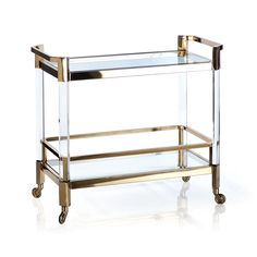 Gold & Acrylic Bar Cart This beautiful cart is the Cadillac of modern bar carts! Dimensions: 35" x 13" x 32"Materials: Stainless Steel / Glass This item ships in 2 boxes. No tools required for assembly. Two people recommended for setting the glass pieces in place. This furniture item is Final Sale. No returns or exchanges. Acrylic Bar Cart, Fine China Patterns, Brass Bar Cart, Acrylic Bar, Modern Bar Cart, Crystal Glassware, Kitchen Cart, Changing Table, Bar Cart