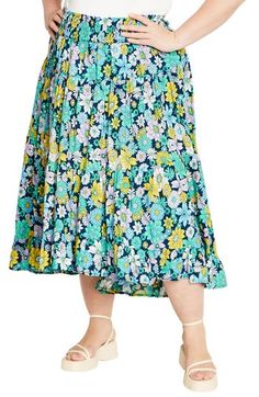 A captivating print and ankle-grazing hem add eye-catching elements to a flowy skirt fitted with a smocked waist for comfortable wear. 38 1/2" length Smocked waist 100% viscose Machine wash, line dry Imported Summer Bottoms With Ruffle Hem And Midi Length, Floral Print Flowy Skirt, Spring Rayon Maxi Skirt With Ruffles, Spring Ruffle Rayon Maxi Skirt, Spring Ruffled Rayon Maxi Skirt, Spring Ruffled Rayon Skirt, Spring Rayon Maxi Skirt With Gathered Details, Spring Midi Bottoms With Ruffle Hem, Flowy Floral Print Skirted Bottoms