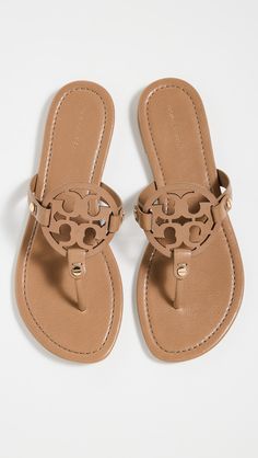 Upper: CowhideLogo cutoutFlat profileRubber soleDust bag includedImported, BrazilThis item cannot be gift-boxedFlip-flopsOpen toeStyle #TORYB50453 Soft Sandals, Pretty Sandals, Miller Sandal, Tory Burch Sandals, Tory Burch Miller, Tory Burch Flats, Tory Burch Miller Sandal, Mule Sandals, Tory Burch Shoes