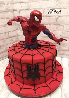 a spiderman cake on top of a table