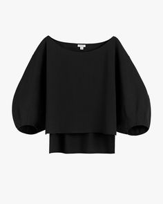 Black blouse with voluminous sleeves and layered hem. Luxury Washed Black Casual Top, Elegant Linen Tops For Layering, Chic Linen Tops For Workwear, Chic Linen Tops For Layering, Chic Linen Blouse For Layering, Black Linen Top For Workwear, Effortless Black Tops For Spring, Effortless Black Top For Spring, Modern Linen Tops For Daywear