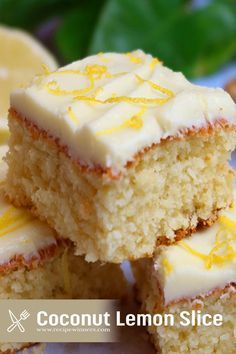 three pieces of lemon slice cake on a plate next to sliced lemons and leaves