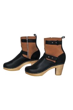 Go for some boho style with a boot that is oh-so-stylish! Made with a clog design, these two-toned beauties from Loeffler Randall are sure to bring in some height and '70s style to any outfit, from maxi dresses to your favorite flared jeans. Size 9 (EU 39) Leather upper Side zipper closure Clog style with wooden platform and heel Rounded toe with stitching Leather interior with no signs of wear Man-made sole with very little wear Heel 3" Boot shaft 5" Loeffler Randall Shoes, Clogs Style, French Girl Chic, Chic Shop, Buy Shoes Online, Loeffler Randall, Stitching Leather, 70s Fashion, Black And Tan