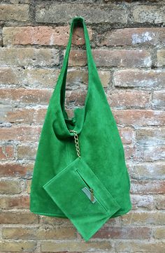 LARGE slouch leather bag in GREEN . Leather tote bag. Closed with a zipper at the top. Natural genuine SUEDE leather. NOT LINED. We added a small leather zipper pouch for your mobile phone and/or cards or money. It ist attached to the inside of the bag by a metal chain. This listing is for the bag in bright GREEN , there is a separate listing in our shop for moss green and also for the dark green bag on the last picture with the model. THIS STYLE IN BRIGHT GREEN comes with the zipper at the top Green Leather Hobo Bag With Large Capacity, Green Leather Hobo Shoulder Bag, Green Large Capacity Hobo Bag, Green Leather Pouch Bag, Large Capacity Green Hobo Bag, Green Leather Tote Hobo Bag, Green Leather Hobo Tote Bag, Green Pouch Hobo Bag For Shopping, Green Hobo Bag For Daily Use