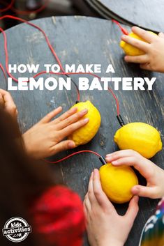 two hands holding lemons on a table with the words how to make a lemon battery