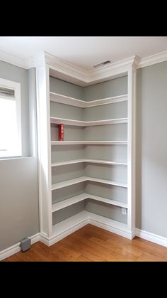 empty shelves in the corner of a room