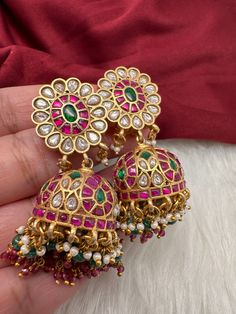 Jadau Kundan Jhumka Earrings screwback earringsColor : GoldenSize : Length : 2.25 Inches; Weight : 23 grams eachStones : Red Green Jadau Kundan Pearls Green Red Beads Kundan Jhumkas, Kundan Jhumka Earrings, Jadau Earrings, Kundan Jhumka, Red Beads, Jhumka Earrings, Red Bead, Gold Jewelry Fashion, Indian Jewelry