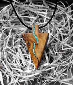 Earth Vibe Botanicals Handmade Wooden Arrow/Spear Head Necklace With Crushed Turquoise Stone Inlay.  Made From Pippy Oak Burr Burl Wood From England. This can also be made with other stone or opal inlay. Size of pendant 50mm by 30mm. This can be made bigger or smaller if required.  *NECK CORD OPTIONS* (Please leave message which cord and length required) Adjustable Waxed Cotton Cord (slip knot) in Black, Brown, Tan, Sage, Cream, Beige, Blue, Turquoise. they are adjustable with slip knots, 1mm th Wood Necklace Ideas, Turquoise Triangle Jewelry Gift, Turquoise Triangle Jewelry For Gifts, Wooden Jewelry Handmade, Wood Necklace Men, Deer Horn Jewelry, Wooden Necklaces, Wood Pendants, Wooden Arrow