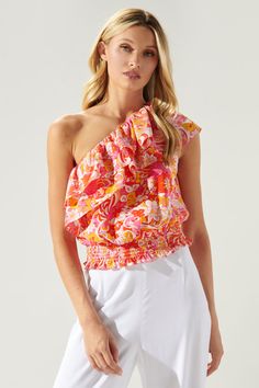 Shake, move, and groove in this darling one shoulder top. A super groovy retro inspired print works to shape this ruffled top with a blouson bodice and smocked waist. An elastic casing is placed along the neckline, ensuring the sleep to stay in place. Easily wear it with your choice of bottoms and heels.- One shoulder- Ruffle layers- Smocked waist- Lightweight - Color: MultiSize + Fit - Model is 5'8" and wearing size XS- Measurements taken from size S - Chest: 18"- Length: 20 1/2" Fabric Self: 9 Chili Board, Elastic Casing, Strawberry Color, Ruffle Crop Top, Groovy Retro, One Shoulder Top, Ruffled Top, Island Style, One Shoulder Tops