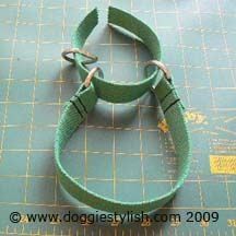 a pair of green dog leashes sitting on top of a cutting board next to scissors