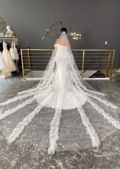 Beautiful cathedral length wedding veil for bride shown in a bridal store. Tulle veil features beautiful ruffle detailing that cascades down the veil for a dramatic finish. Ruffle Veil Wedding, Veil For Bride, Wedding Gown Preservation, Veil Wedding, Cathedral Veil, The Modern Bride, Dramatic Look, The Veil, Bridal Shop