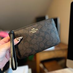 Here I Have Coach Large Corner Zip Wristlet In Signature Canvas.. New With Tags! Large Wristlet! So Pretty.. Could Be Used As A Wristlet Purse And Or Slim Wallet .. The Size Is 7 3/4" (L) X 4 3/4" (H) X 1/2" (W) This Is A Large Wristlet That Can Be Used As A Clutch As Well And Also As A Big Wallet Or Mainly As Just A Wristlet So Beautiful! Signature Coated Canvas And Smooth Leather Two Credit Card Slots Zip Closure, Fabric Lining Wrist Strap Attached 7 3/4" (L) X 4 3/4" (H) X 1/2" (W) Style No. Coach Wristlet Wallet, Girly Bags, Wristlet Purse, Fancy Bags, Coach Wristlet, Signature Canvas, Slim Wallet, Wristlet Wallet, Wrist Strap